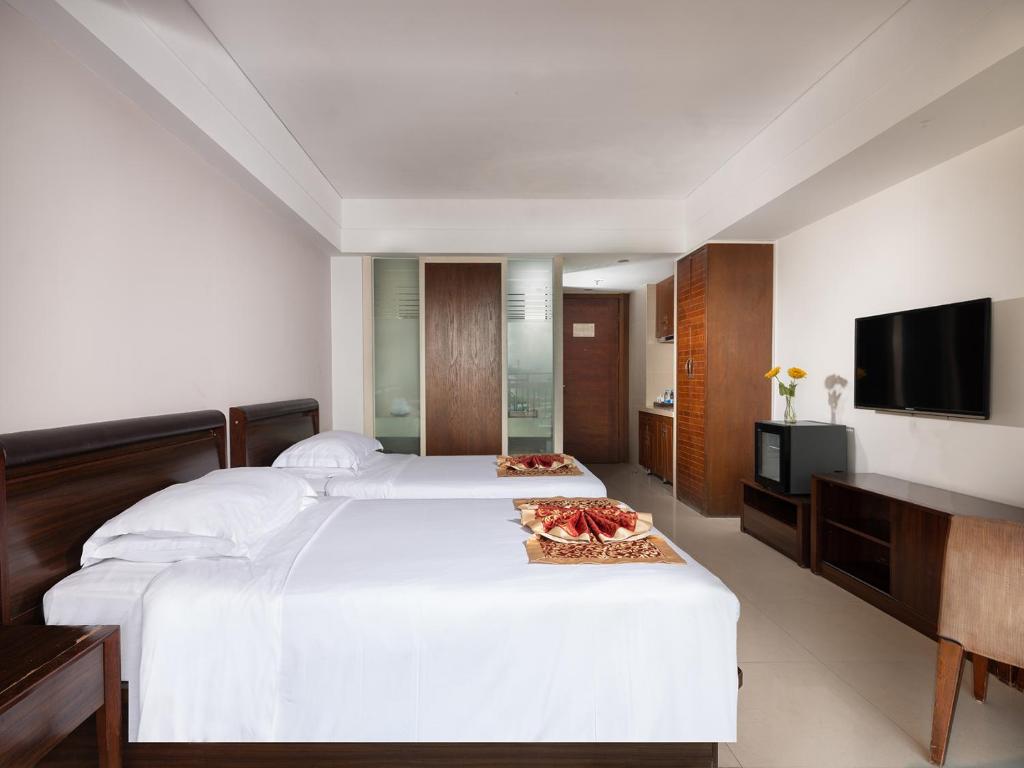 Отель BARRY BOUTIQUE SEAVIEW HOTEL SANYA 2 раздельные кровати в номере.jpg